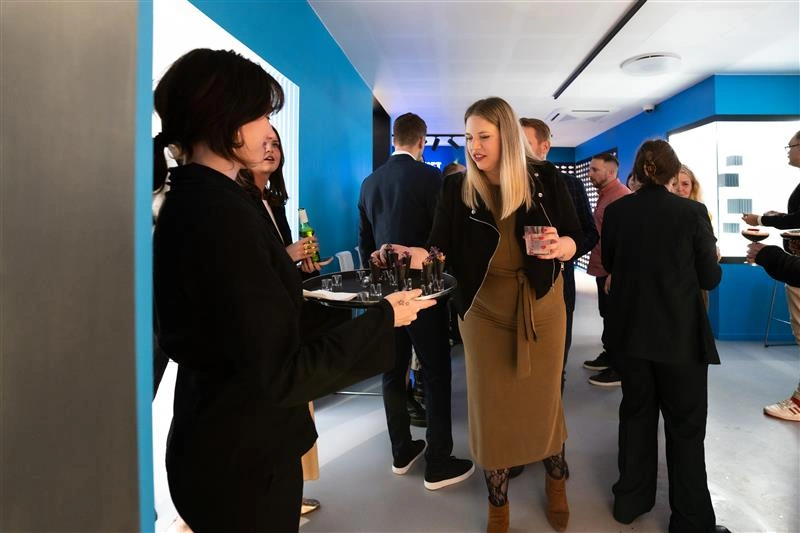 People are having drinks at an event at Museum of Illusions Copenhagen.